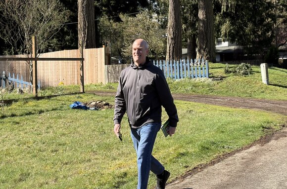 Rick Larsen knocking on doors